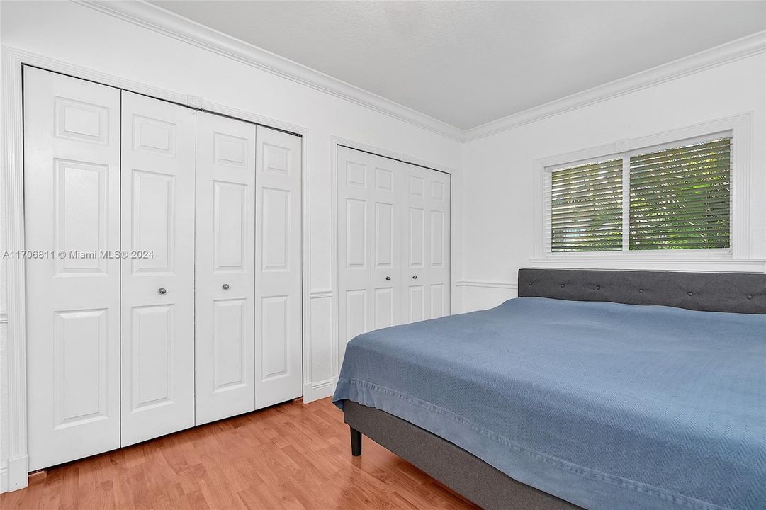 Bedroom closet with built-in shelving.