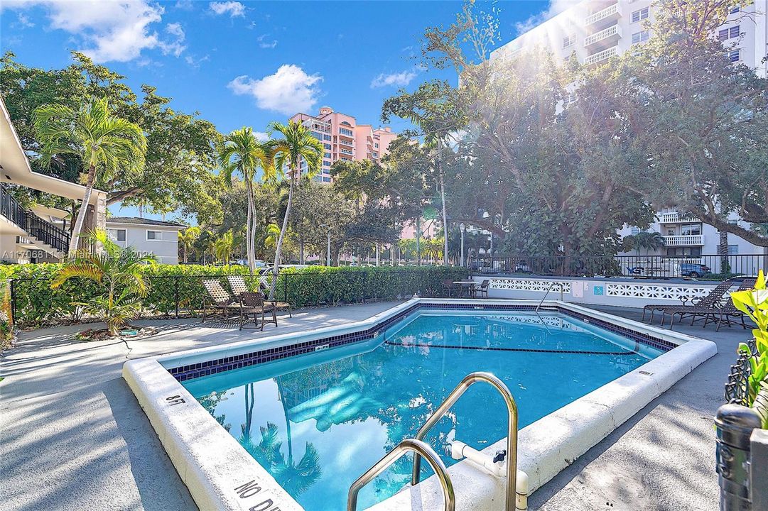 Condo pool where you can sunbathe and dip in to refresh