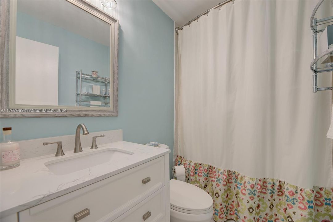 Guest bathroom with tub