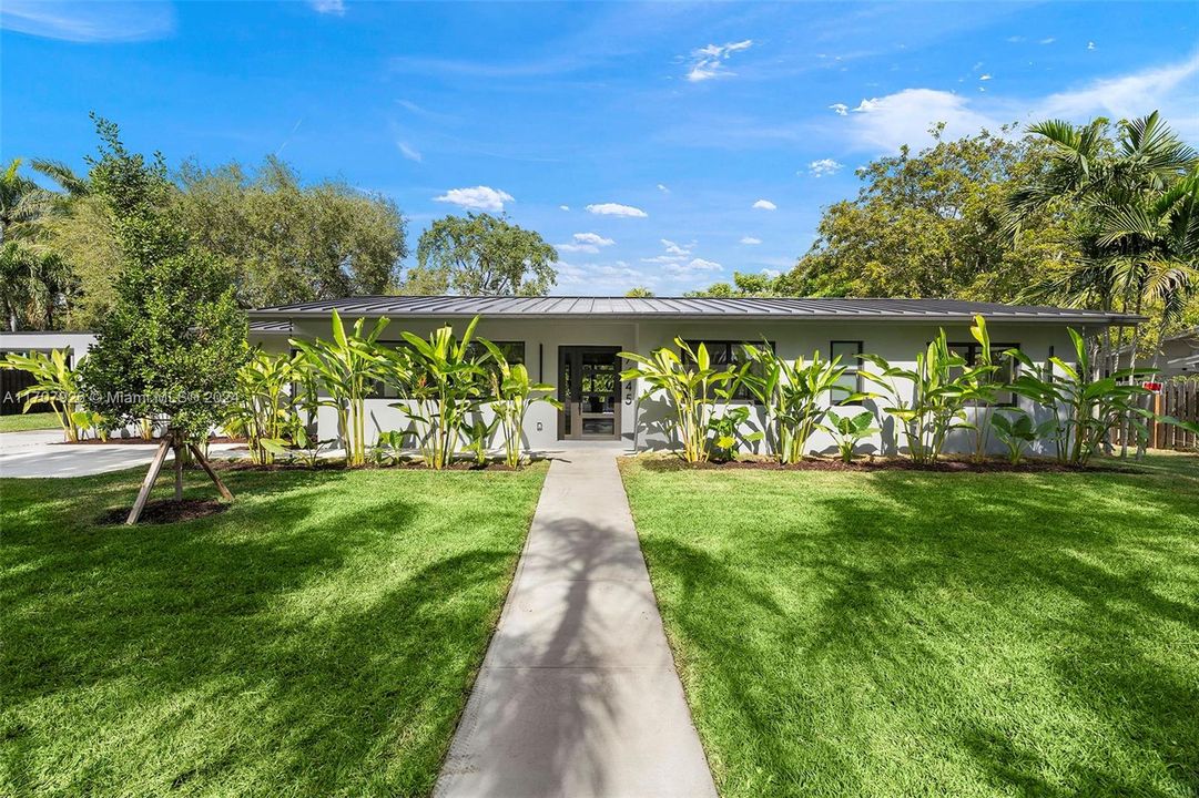 The property blends impeccable landscaping with a fully remodeled interior, creating a unique and sophisticated atmosphere