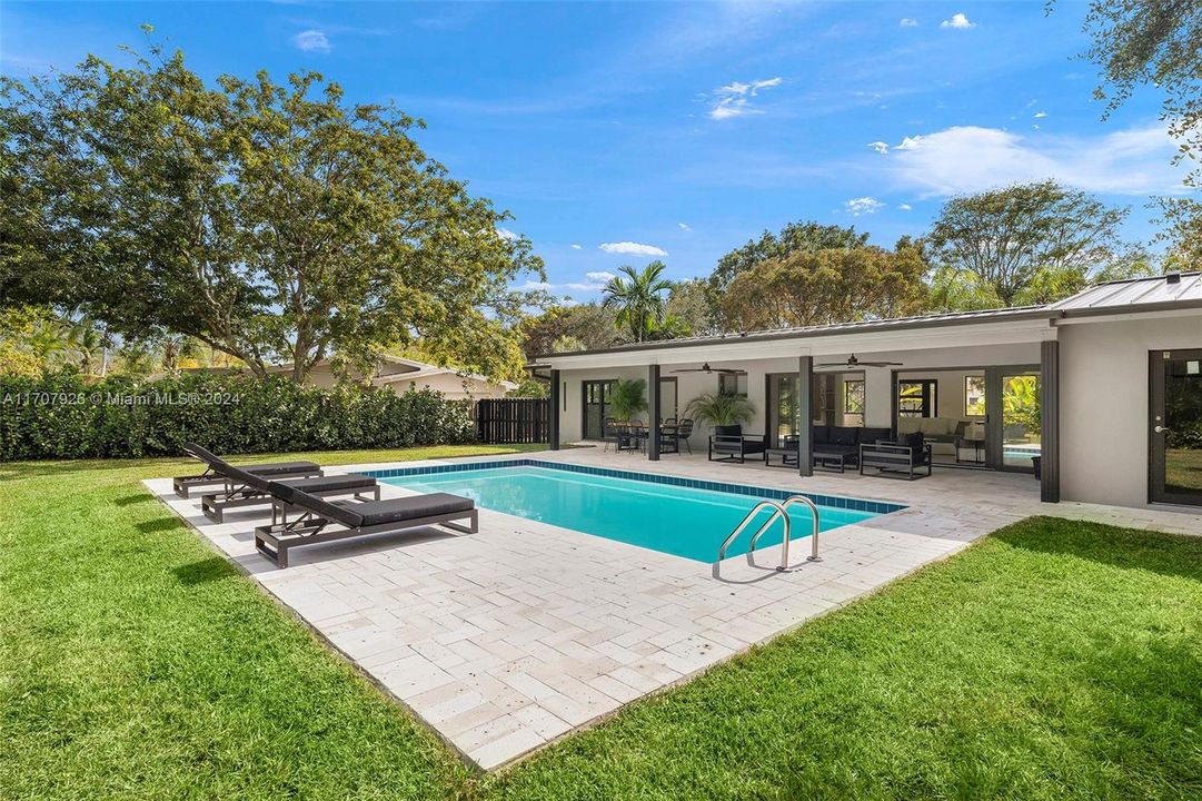 Stunning pool area designed for both relaxation and entertaining