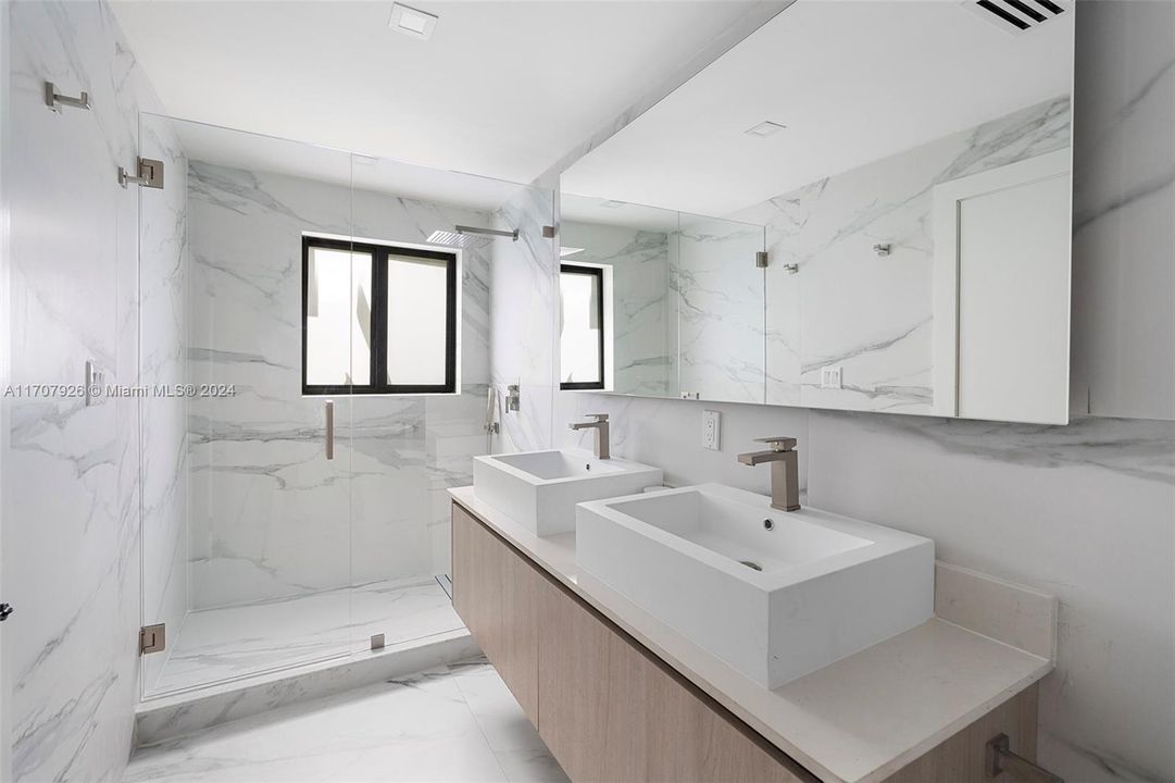 Elegant master bath with dual vanities