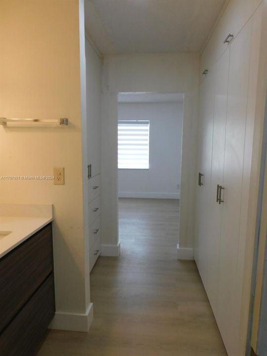 Bathroom view to primary bedroom.