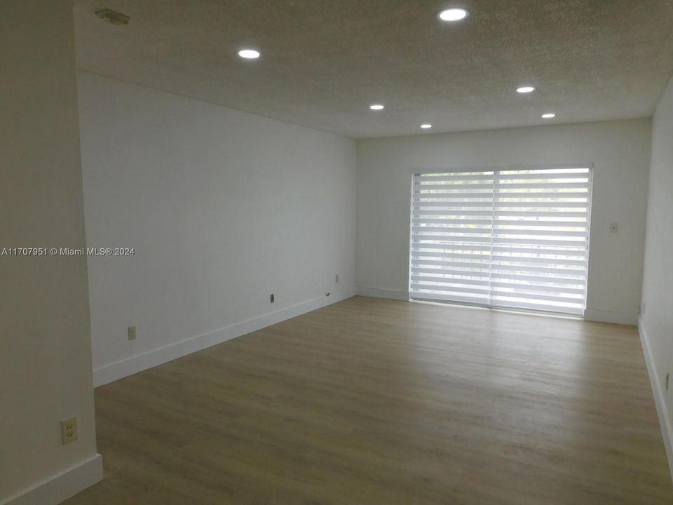 Living room is spacious - plenty of wall space - luxurious vinyl plan flooring throughout the entire unit.