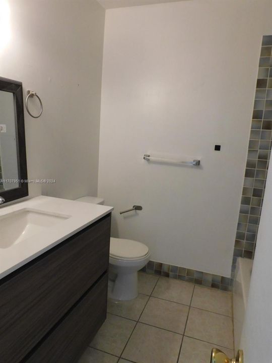 2nd bathroom with new vanity and mirror.