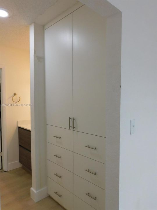 Closets with plenty of drawers and hanging utility.