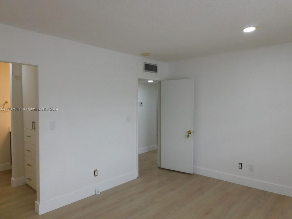 View to bedroom entry way - all bedrooms doors will be replaced with new ones.