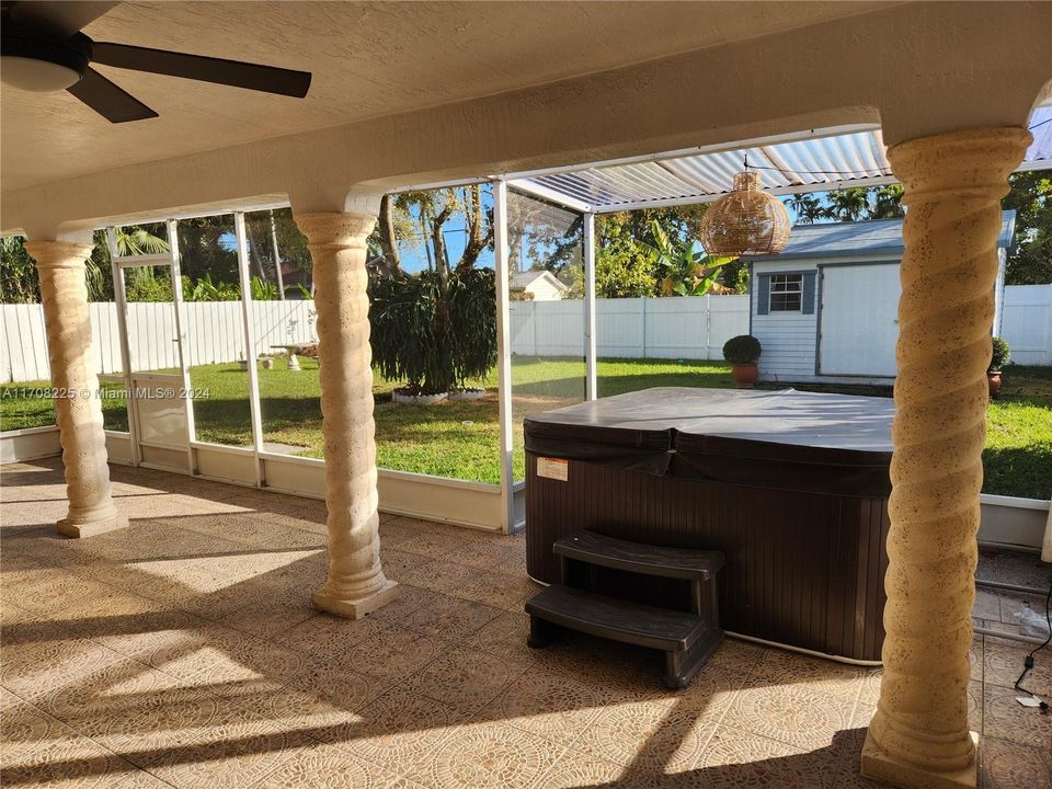 screened in patio with hot tub