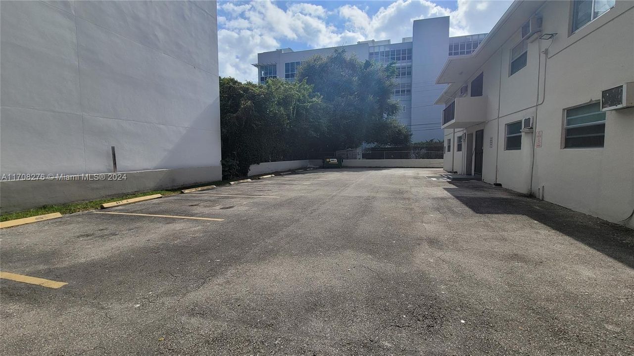 Private resident parking lot behind building