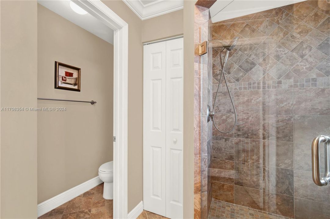 Master bedroom's bathroom has shower and the toilet can be separated by closing the door.