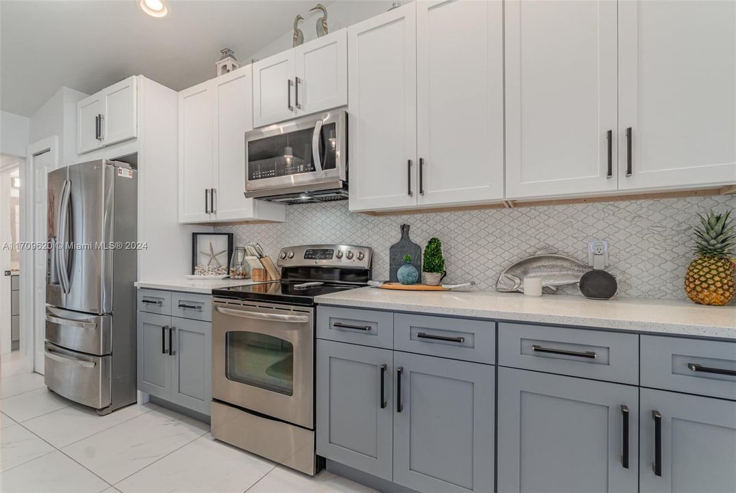 Quartz counters and tile backsplash