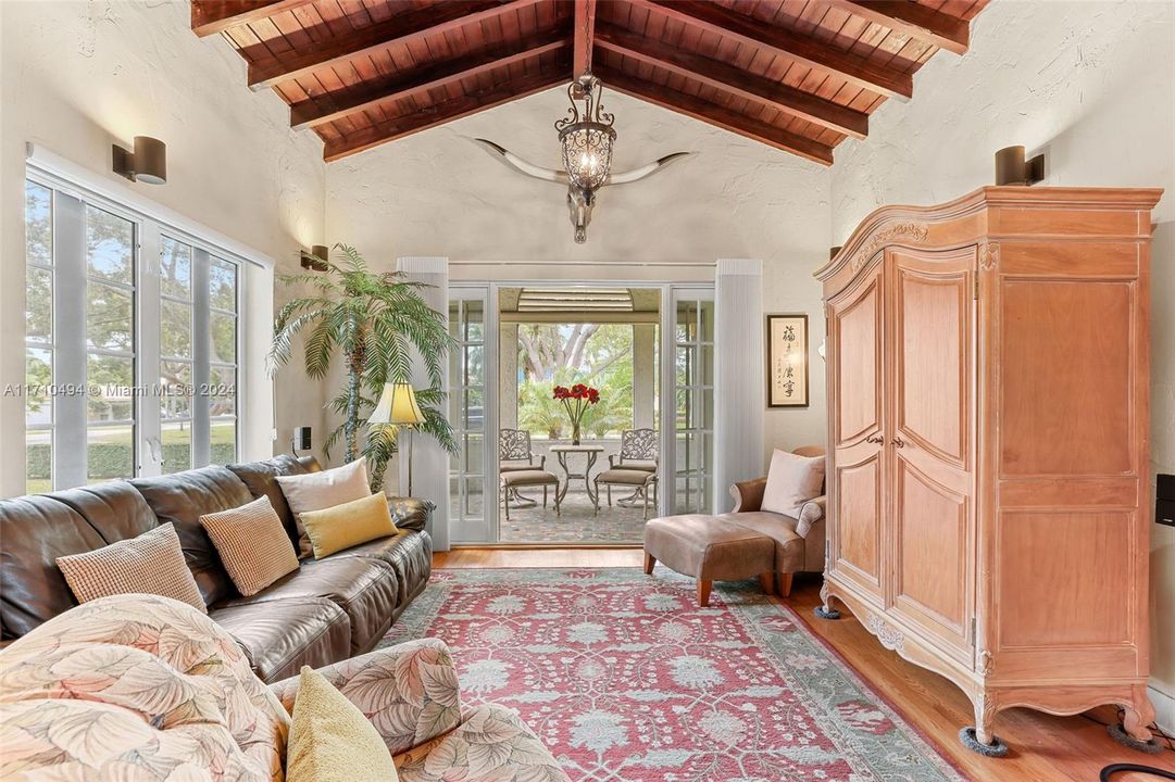 Living room w adjacent screened in porch