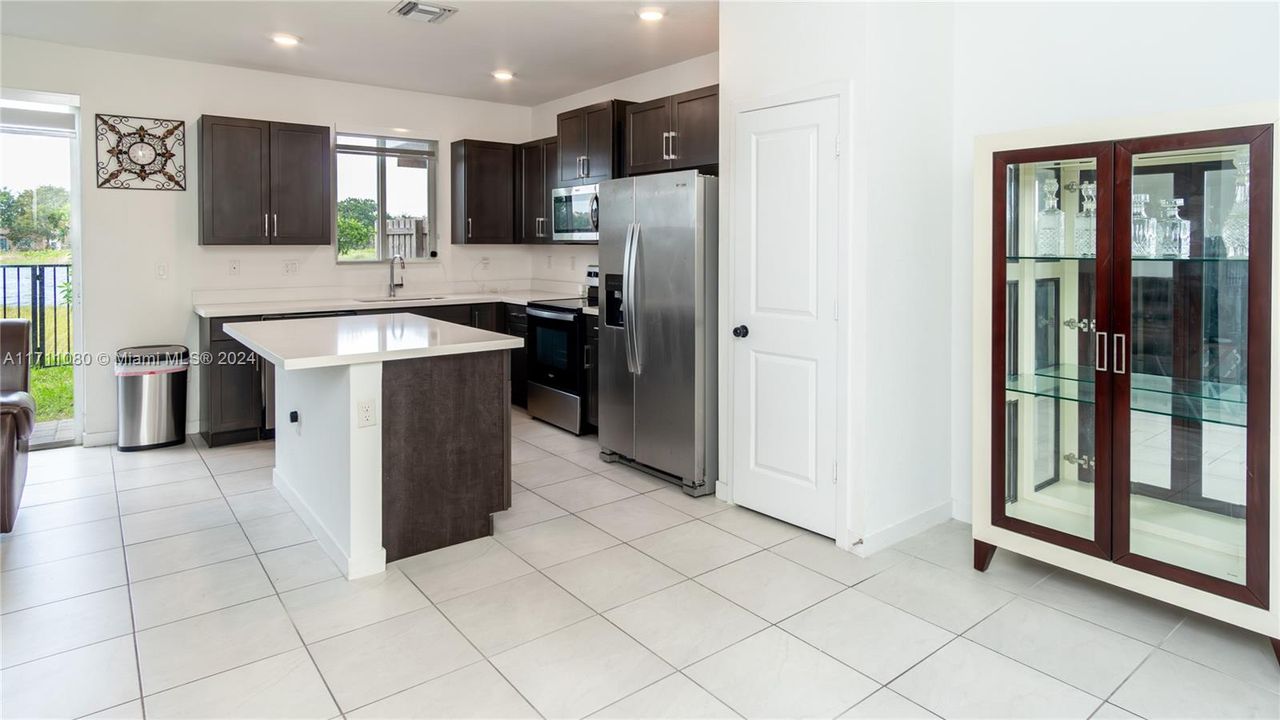 Contemporary style. Quartz counters, stainless appliances, pantry