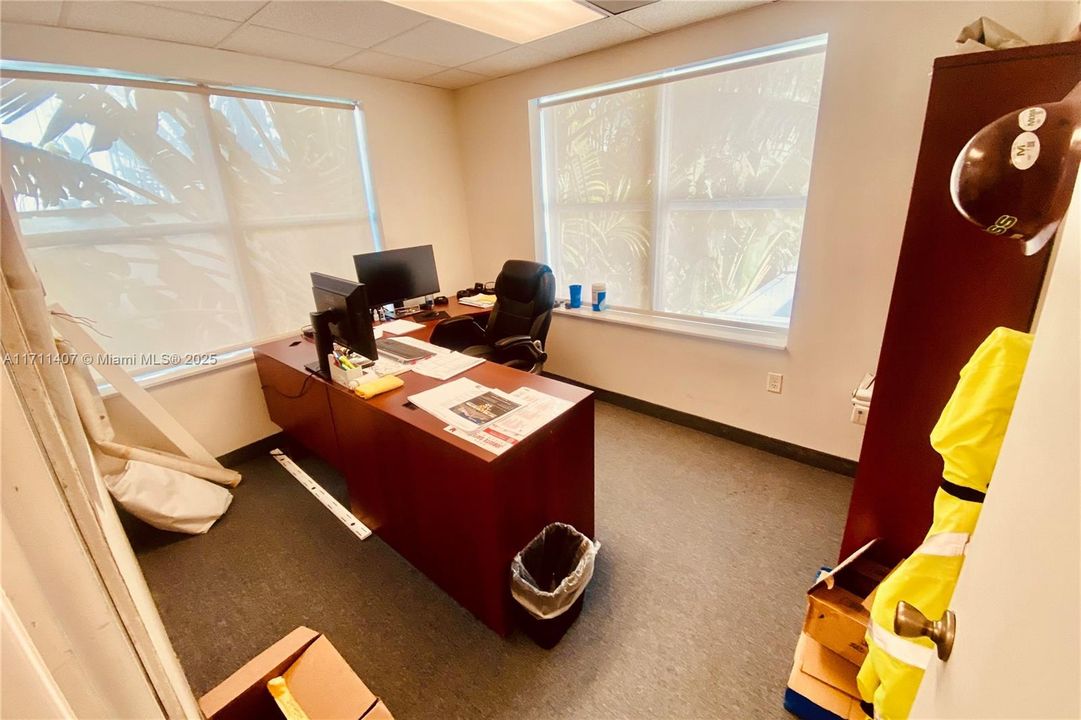 Private Corner Office overlooks Restaurant Courtyard