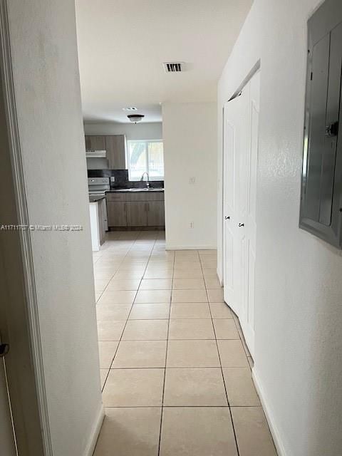 Hall to enter kitchen and Dining room.