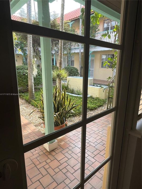 Front door to inner courtyard garden and fountain