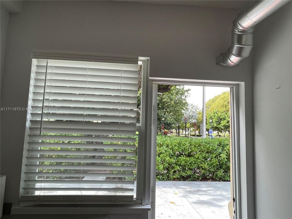 kitchen entry to private patio across from park