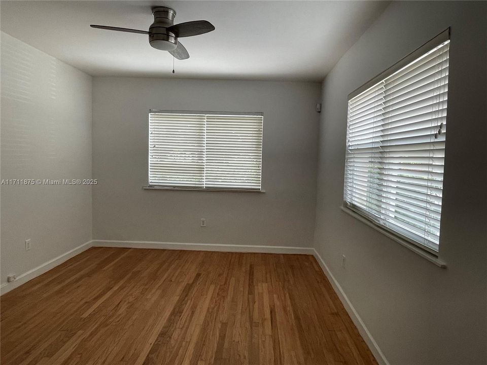 Corner Light with Fan across from Park with wood floors