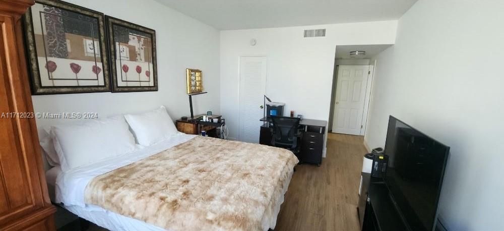 large bedroom also with  porcelain floors and NO Popcorn , can put a TV on the wall