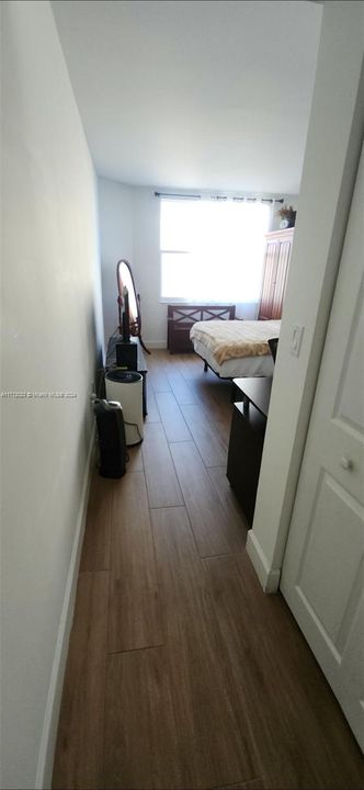 Foyer entrance to the bedroom with several closets