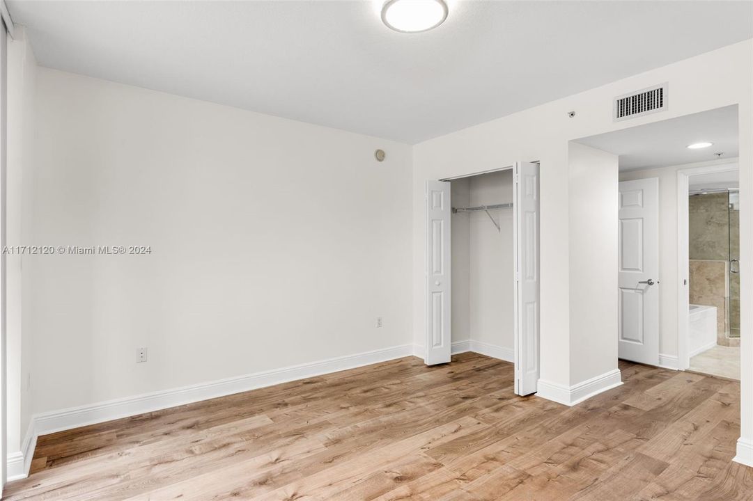 Primary bedroom with walk-in closet plus bonus second closet