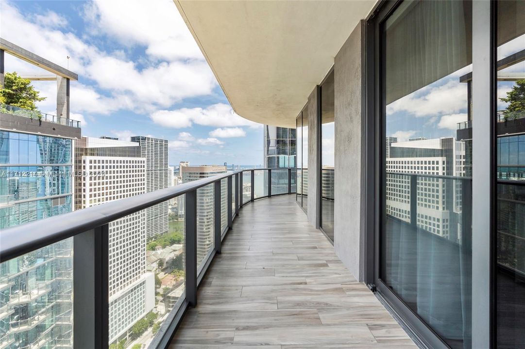 balcony facing city view and partial water view