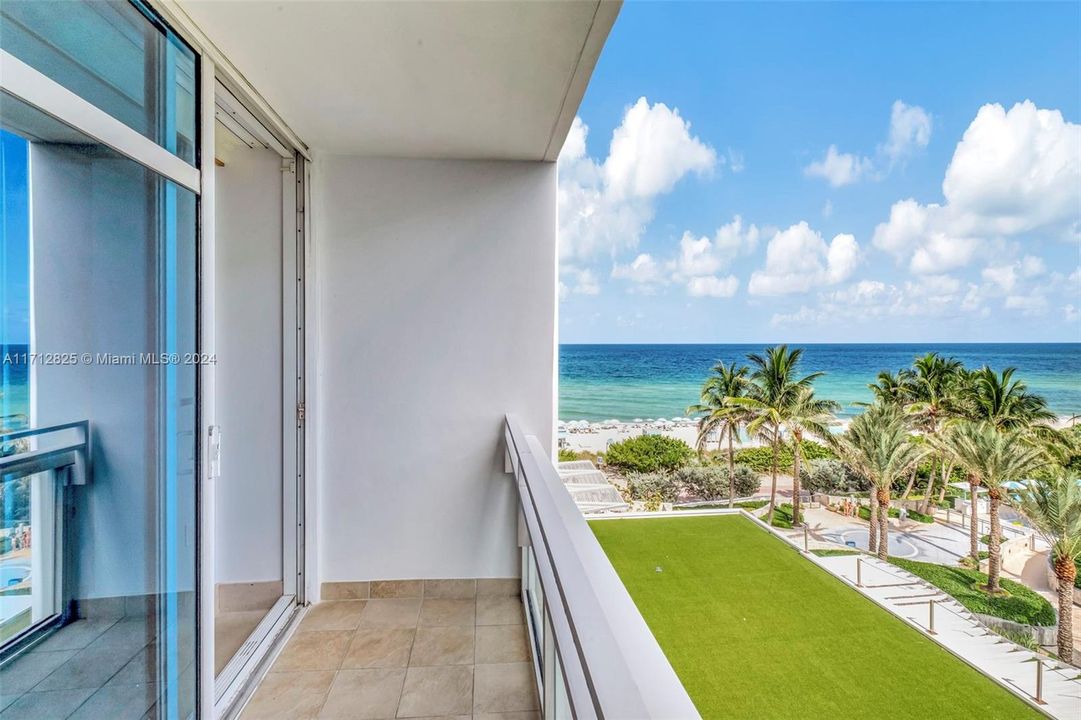 Private South-facing balcony; one of two balconies for this unit.