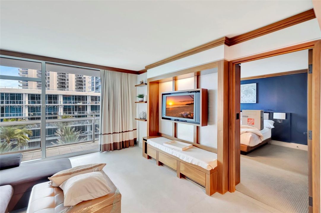 Spacious open floor plan with floor to ceiling windows and balcony of high impact glass.