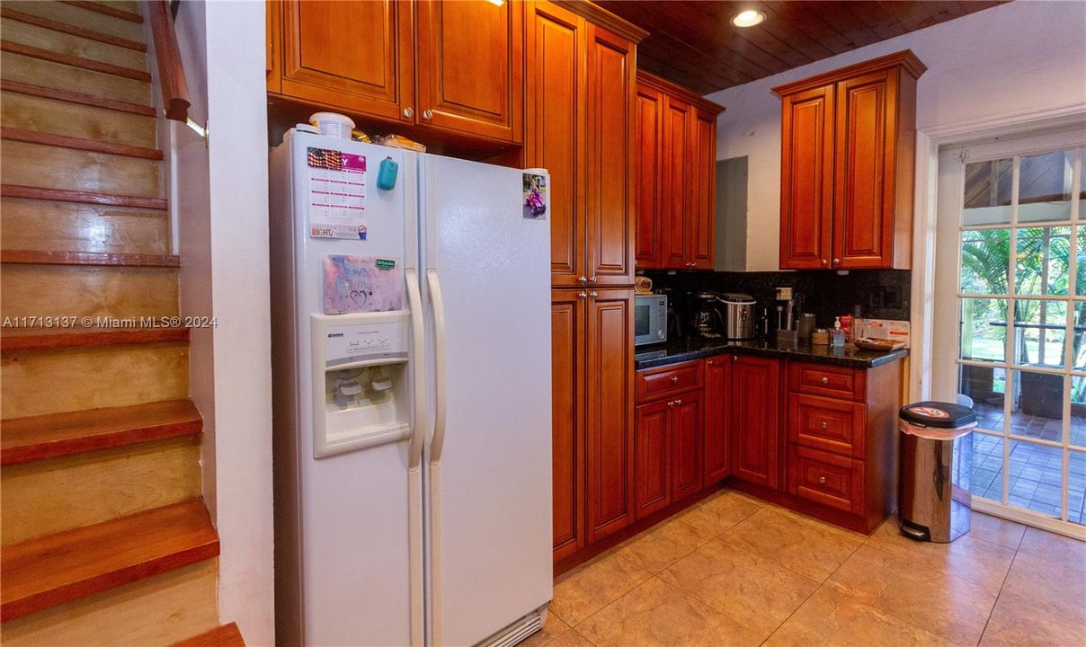 KITCHEN AND STAIRWAY LEADING TO RENOVATED FULL ATTIC AND 1/2 BATH