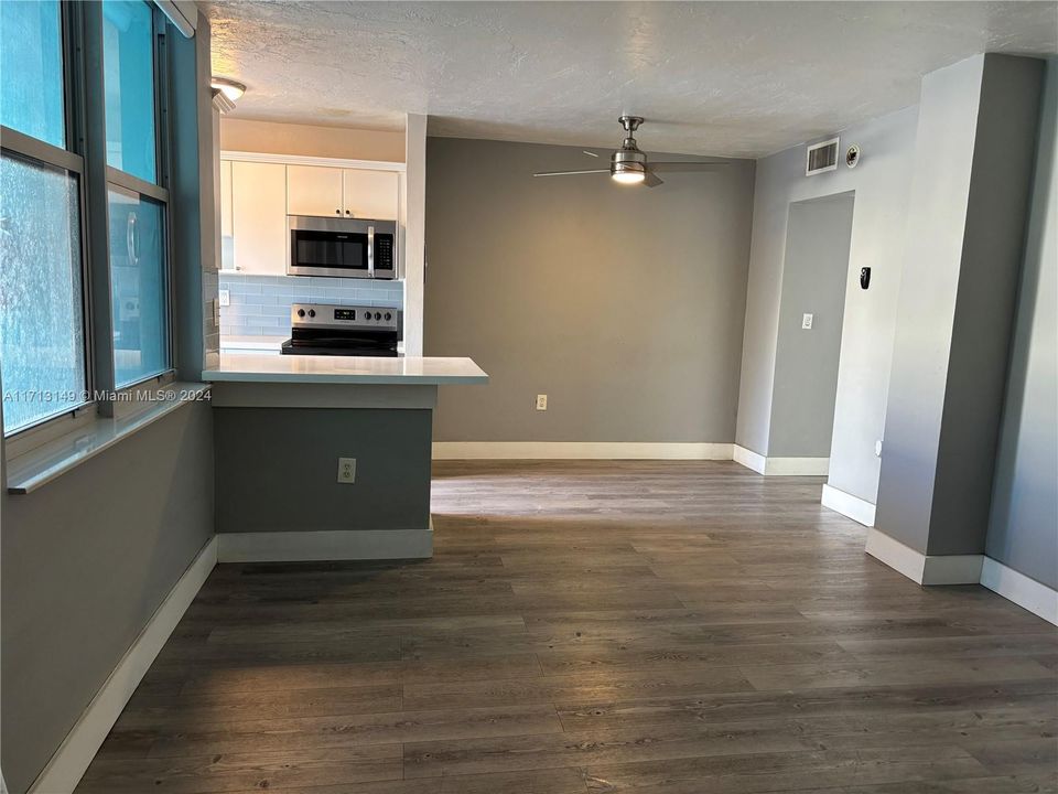 Living room with kitchen isle on the left.