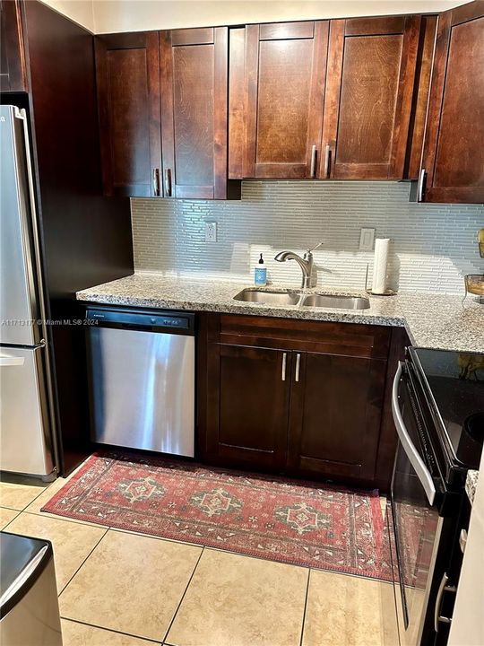 Stainless steel Appliances, Solid Wood Cabinets, and Granite Countertops