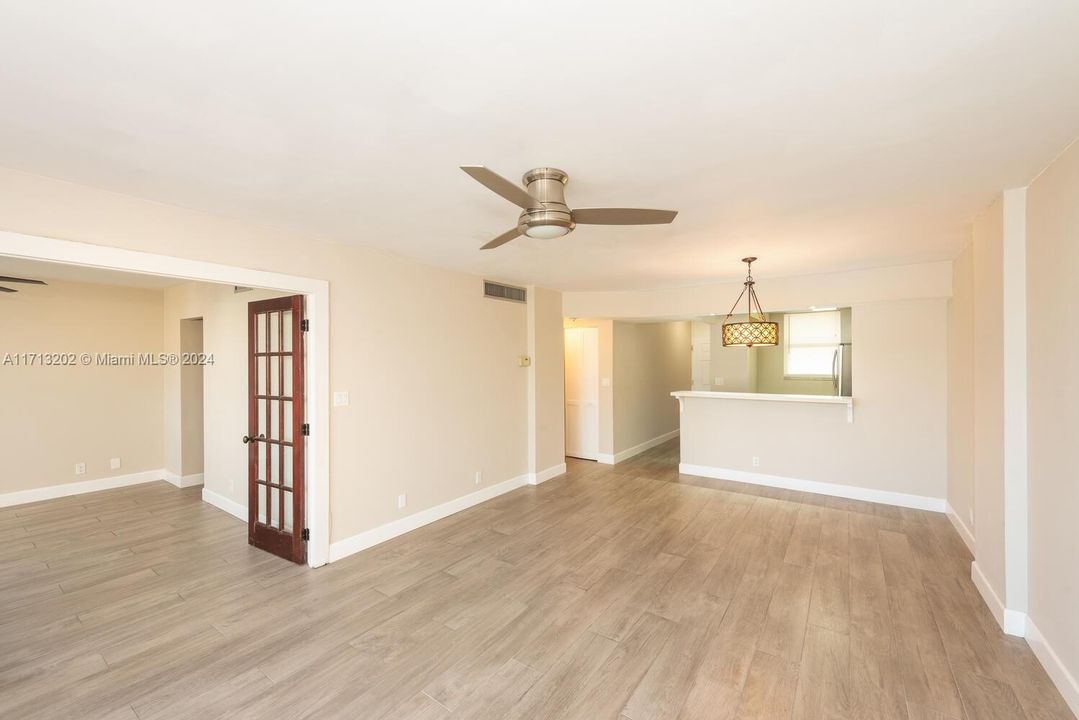 View from living/dining room to bedroom and kitchen.