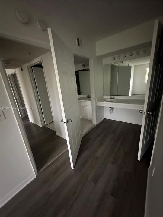 this vanity is outside of the bathroom and is in the bedroom