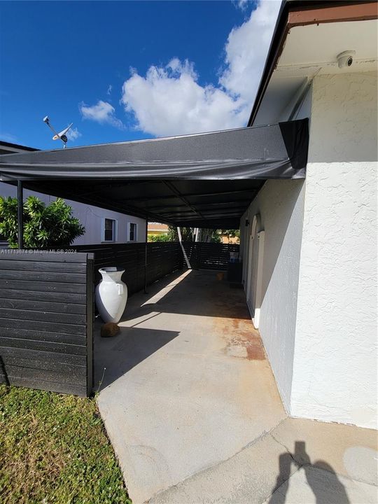 SIDE OF HOUSE UNDER AWNING