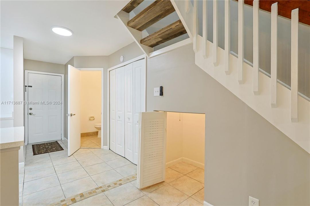 Guest bathroom with store under the stairs