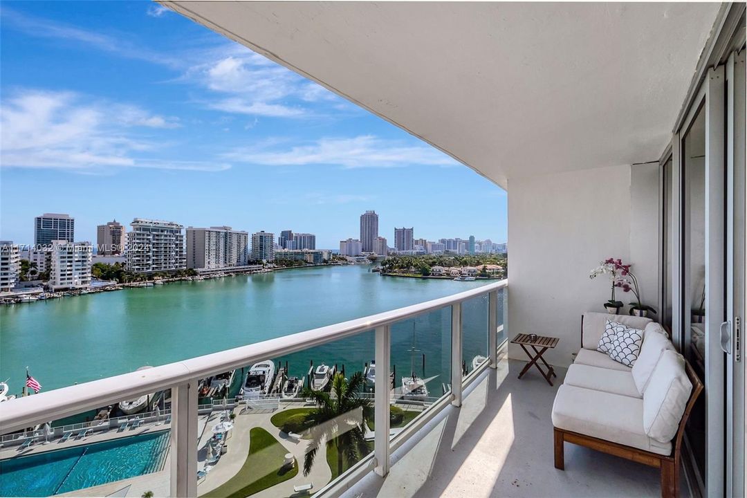 Spacious balcony with room for dining table and sofa overlooking fabulous Miami Beach.