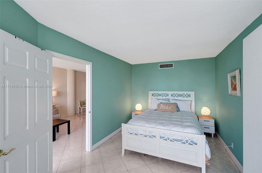 Large primary bedroom has room for sitting area, in-home workspace or more wardrobe space.