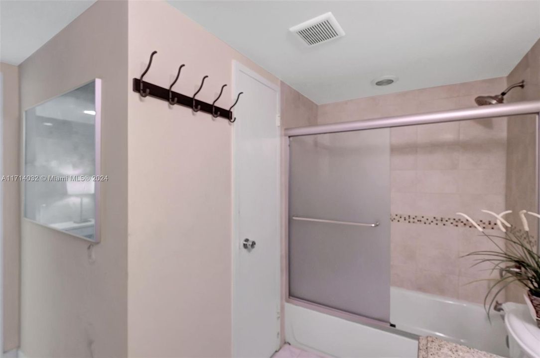 Spacious and tiled bath has large closet/storage. 1 of 4 inside closets in condo. Plus, owner has a storage closet on-site!