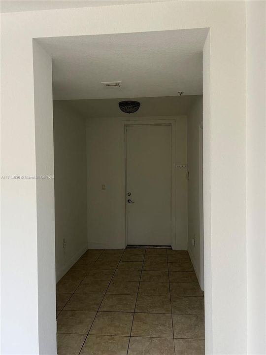 entrance door to unit with a space for office/den