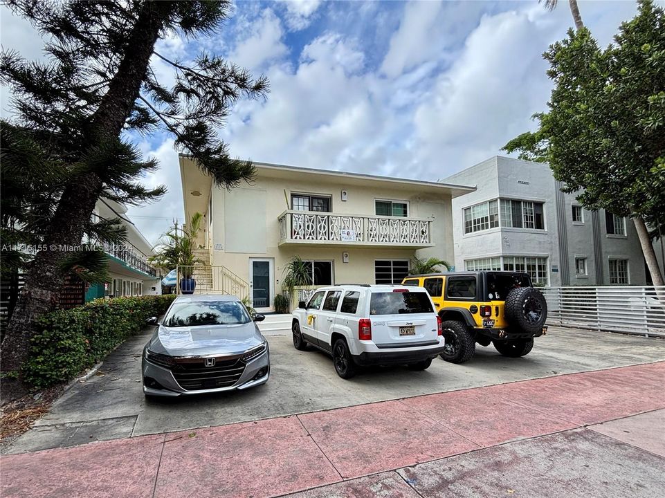 Building Front and assigned parking (White Car)