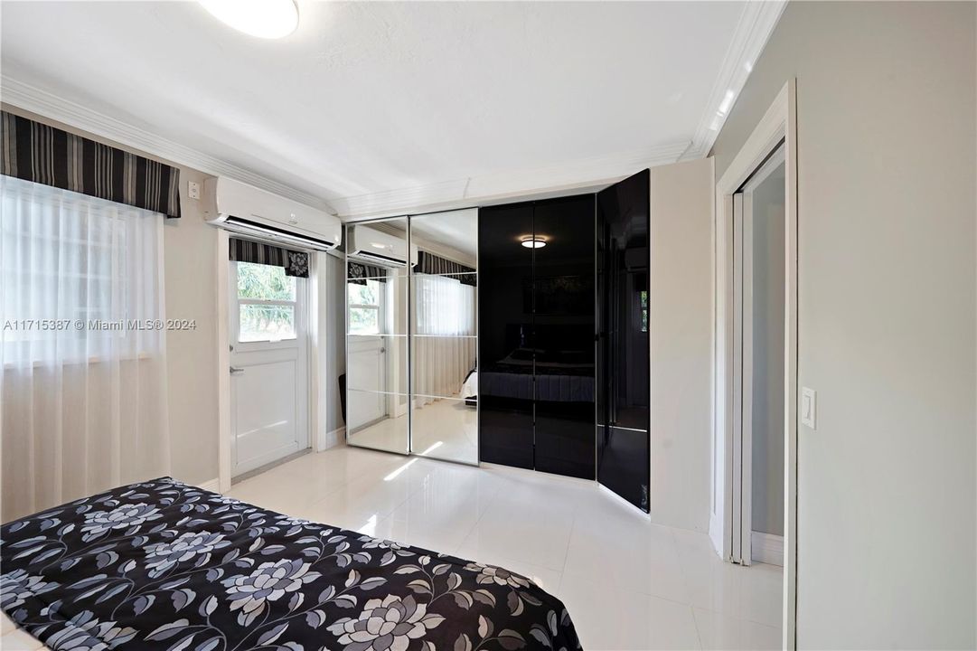 MASTER BEDROOM WITH WALL OF BUILT IN CLOSETS