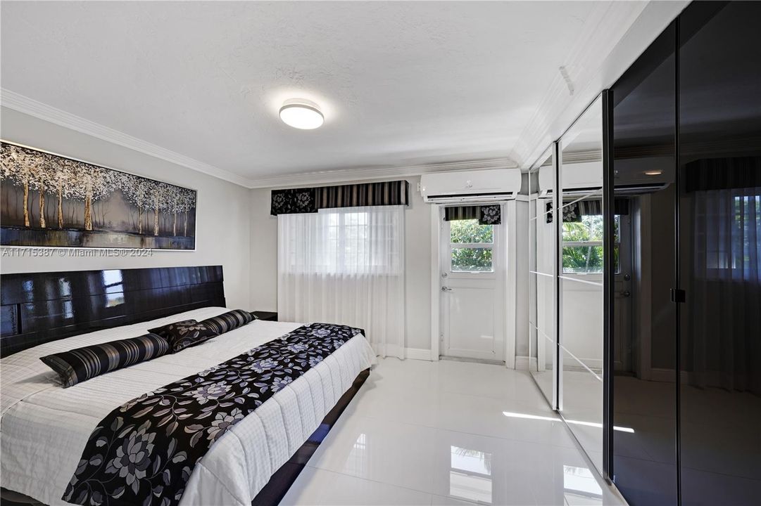 Master Bedroom with built in shelves in closet