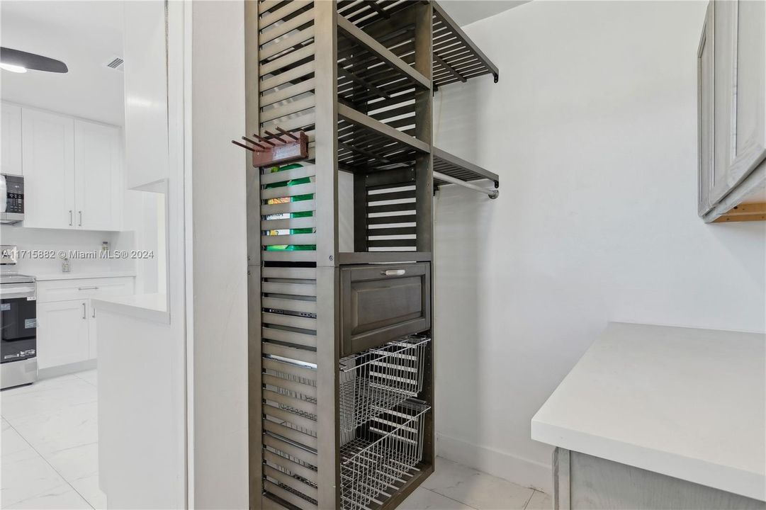 Large laundry room with plenty of storage and folding space