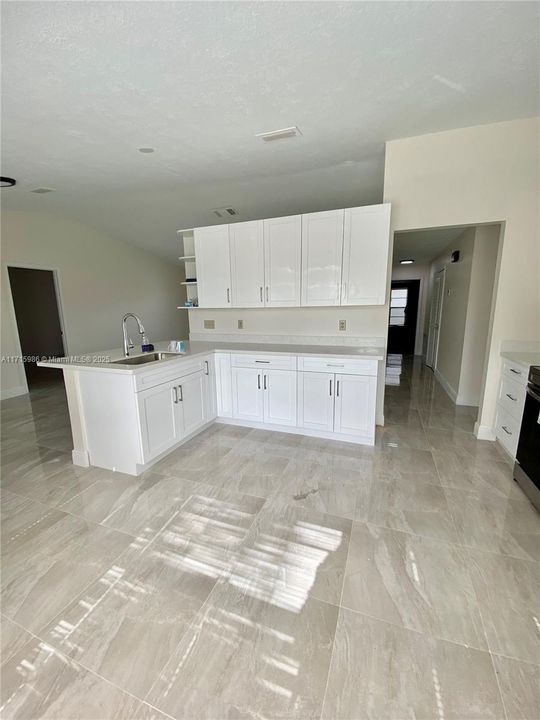 Kitchen view facing entrance