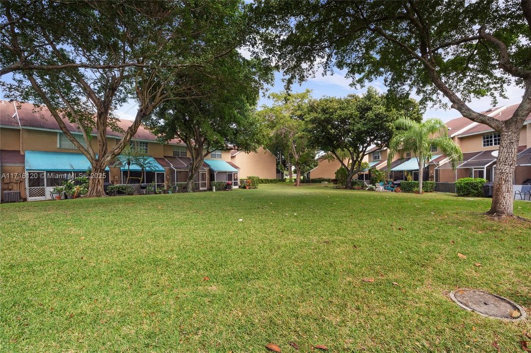 Step out of your patio & into an open shady common area for everyone to enjoy!