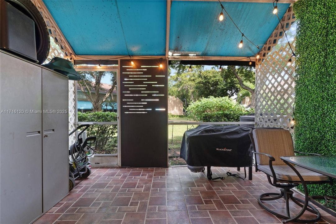 Screened-in patio with storage closet (to the left)