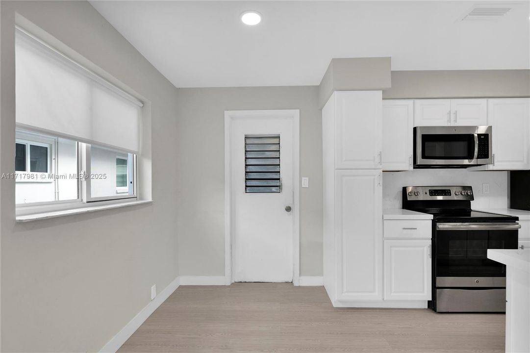 Kitchen, door leading to Garage