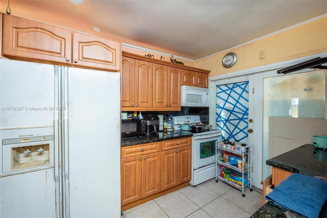 Kitchen #2 Main entrance of home . Back room