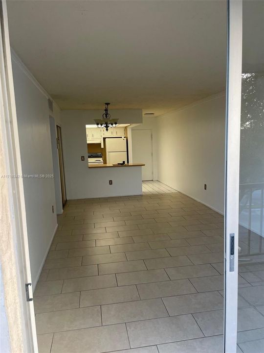 Living Room and Kitchen of unit # 418. Photo was taken from the Balcony.