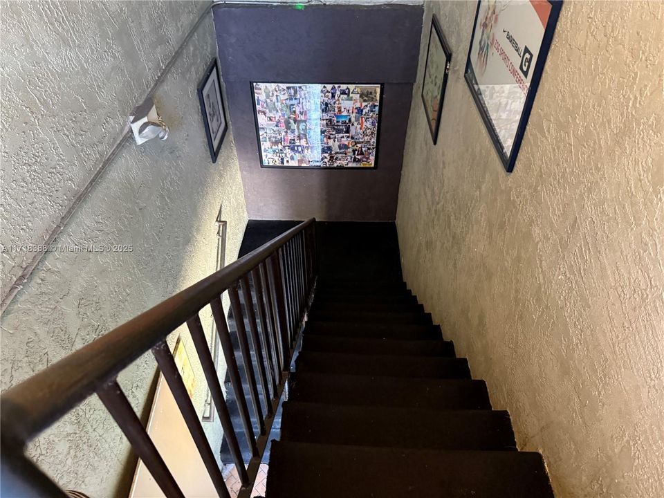 Stairwell leading from the upstairs apartment units